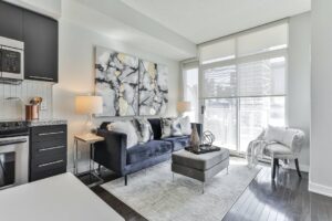 Trendy blue couch in staged Toronto condo